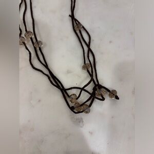Suede necklace with beige beads